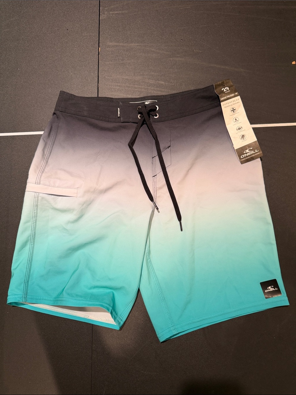 O'Neill NWT Men/Teen  29 board shorts Black to Teal Ombre hyperfreak
